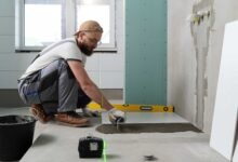 tiler-working-renovation-apartment-bathroom